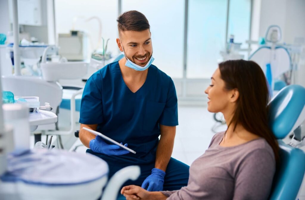 Dental professional consulting a patient about eating after teeth cleaning during a dental appointment