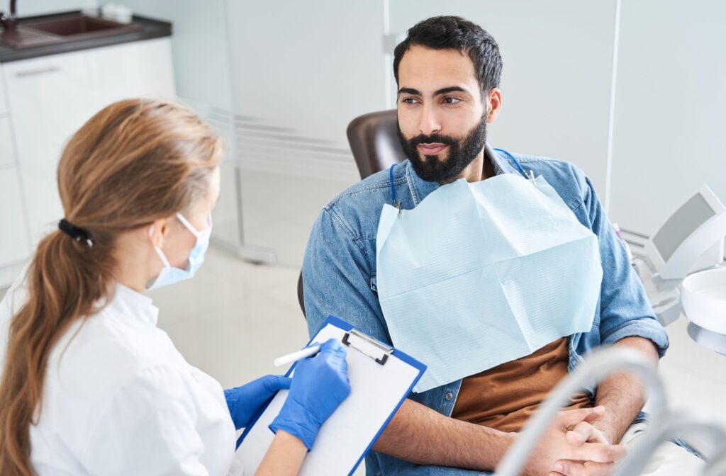 A patient talking to a dentist at a dental clinic